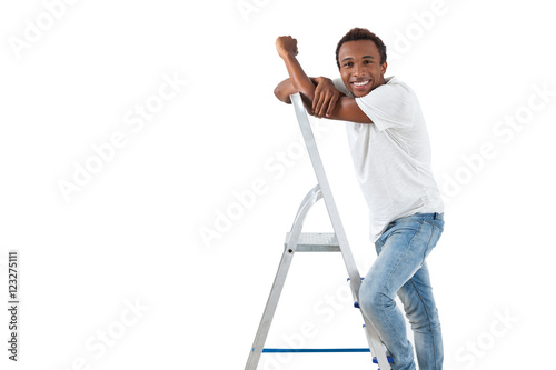 African handiman on step ladder photo