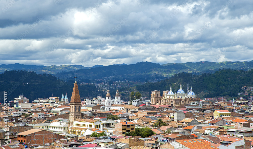 View of the city of Cuenca, Ecuador, with it's many churches and rooftops, on a cloudy day