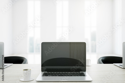 Cafe table with laptop closeup