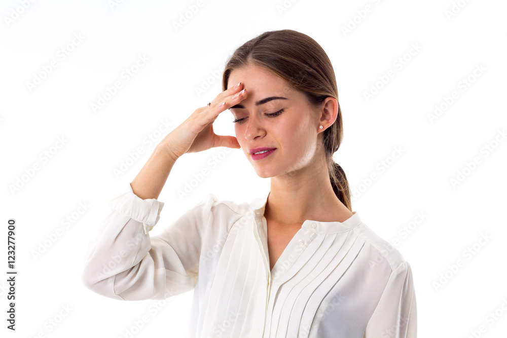 Woman holding hand at her forehead Woman holding hand at her forehead