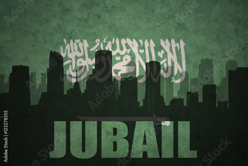 abstract silhouette of the city with text Jubail at the vintage saudi arabia flag background photo