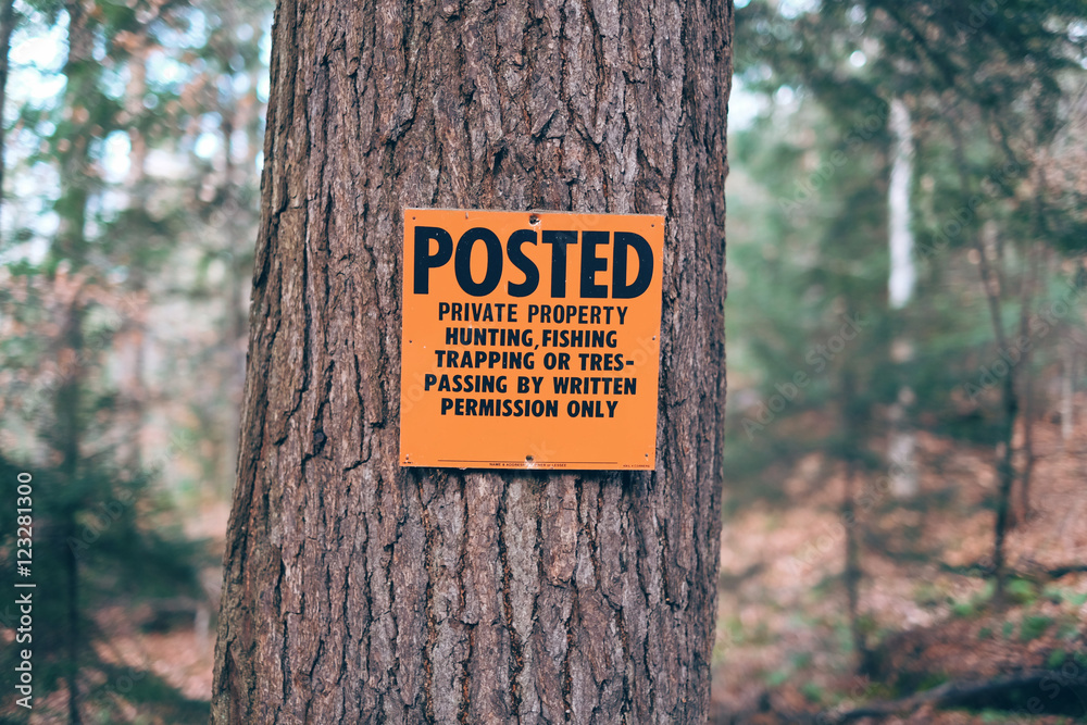 Posted private property orange no hunting,fishing, trapping or t Stock  Photo
