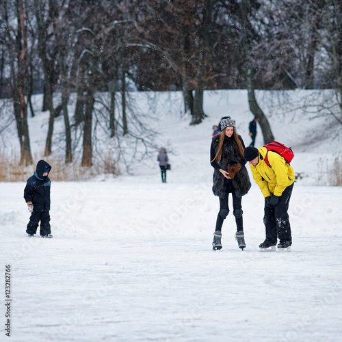 Young girl and fellow at the rink in Trakai