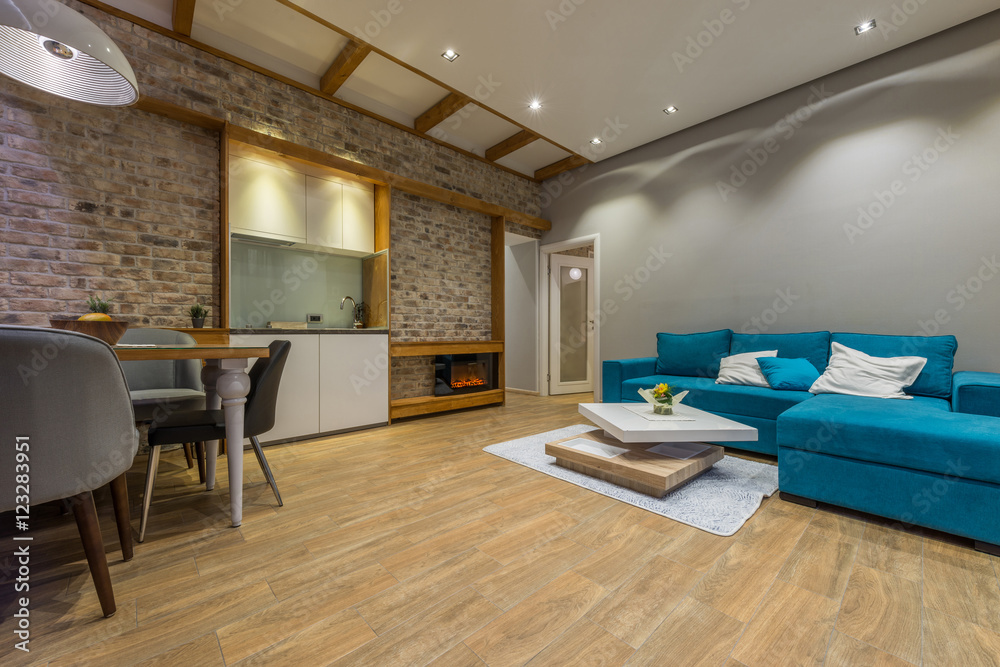 Interior of a modern living room with blue sofa in luxury mansion Interior of a modern living room with blue sofa in luxury mansion