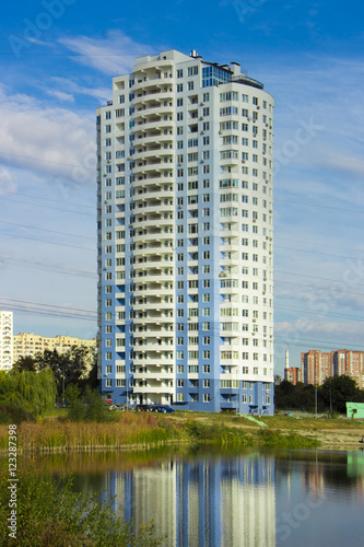 skyscraper on the bank of the lake