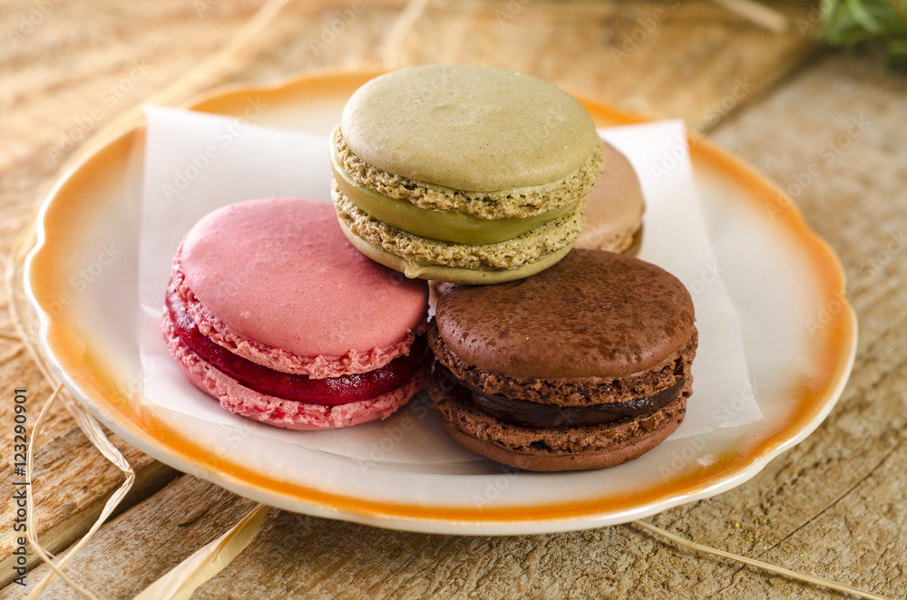 Closeup three macaroons on plate Closeup three macaroons on plate