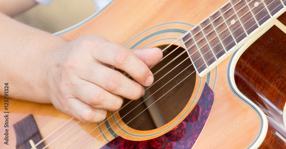 Fototapeta premium hand man playing the guitar
