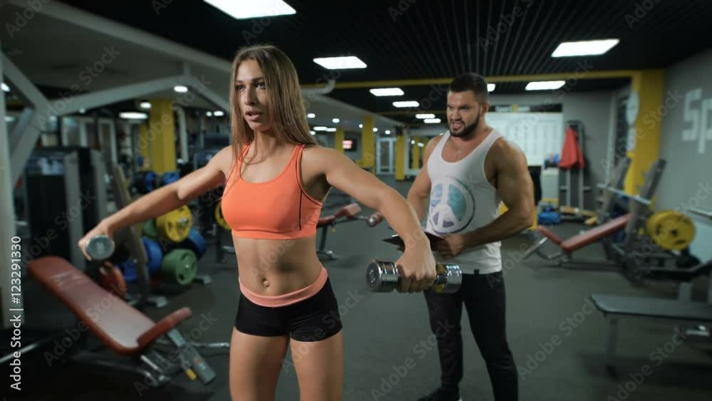 Young girl exercises with personal instructor Young girl exercises with personal instructor