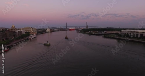 Wallpaper Mural Aerial of tugboats on the Savannah River at dawn with downtown, port, and Talmadge Memorial Bridge. Torontodigital.ca