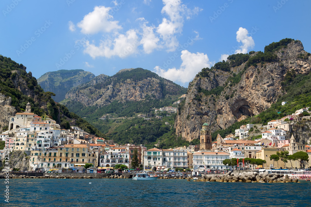 Summer landscape of town Amalfi from Sea, Italy. Amalfi is surrounded by cliffs and coastal scenery. It is included in theUNESCO World Heritage Sites