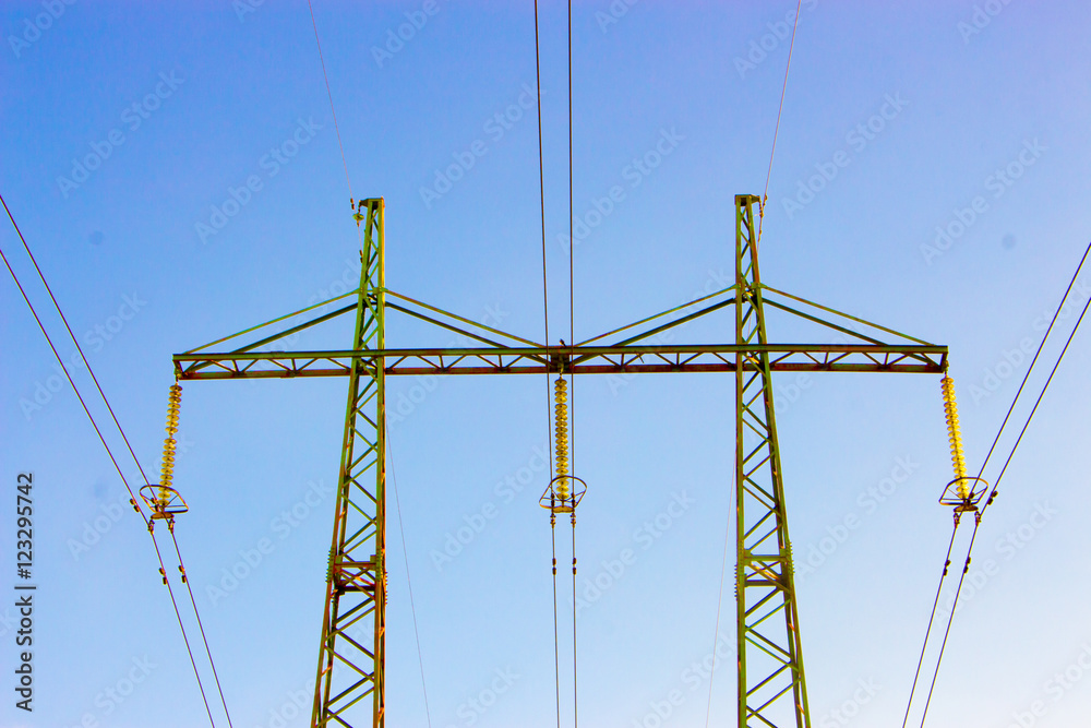 Overhead electrical power lines on steel transmission tower Overhead electrical power lines on steel transmission tower