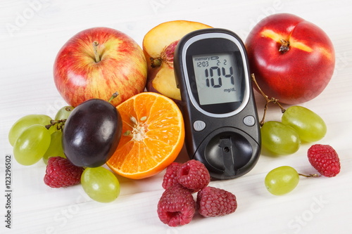 Glucometer and fresh fruits  diabetes and healthy nutrition