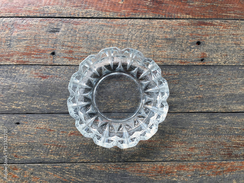 Empty glass ashtray on a wooden table