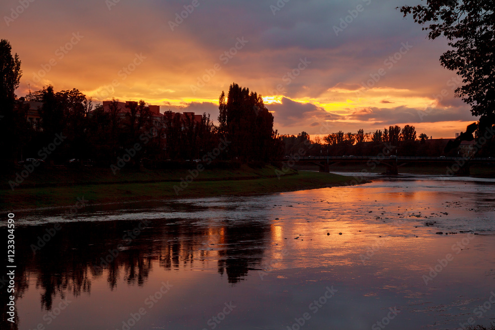 Fototapeta premium River sunset reflection of sun