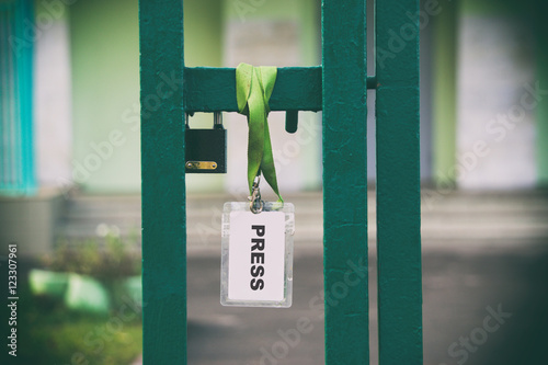 badges for the press, words on paper, white badge insulator