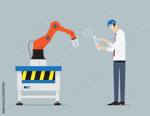 Industry 4.0 Factory Automation Concept. Robot hands controlled by engineer with Tablet PC. .