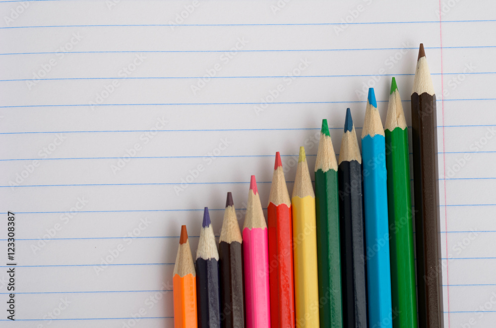 Colored pencils and paper Colored pencils and paper