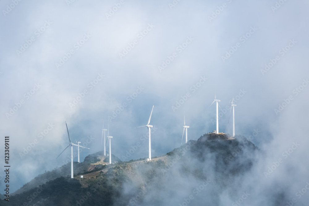 Fototapeta premium wind farms in the misty clouds