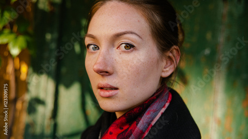 Beautiful girl in black coat oudoor