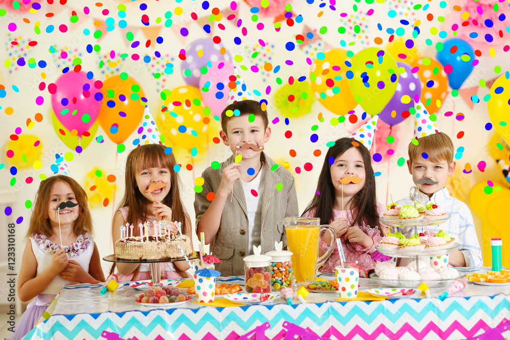 Happy group of children with paper mustache having fun at birthday party Happy group of children with paper mustache having fun at birthday party