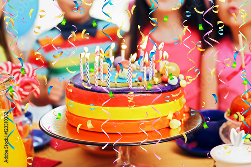 Children blowing candles on...