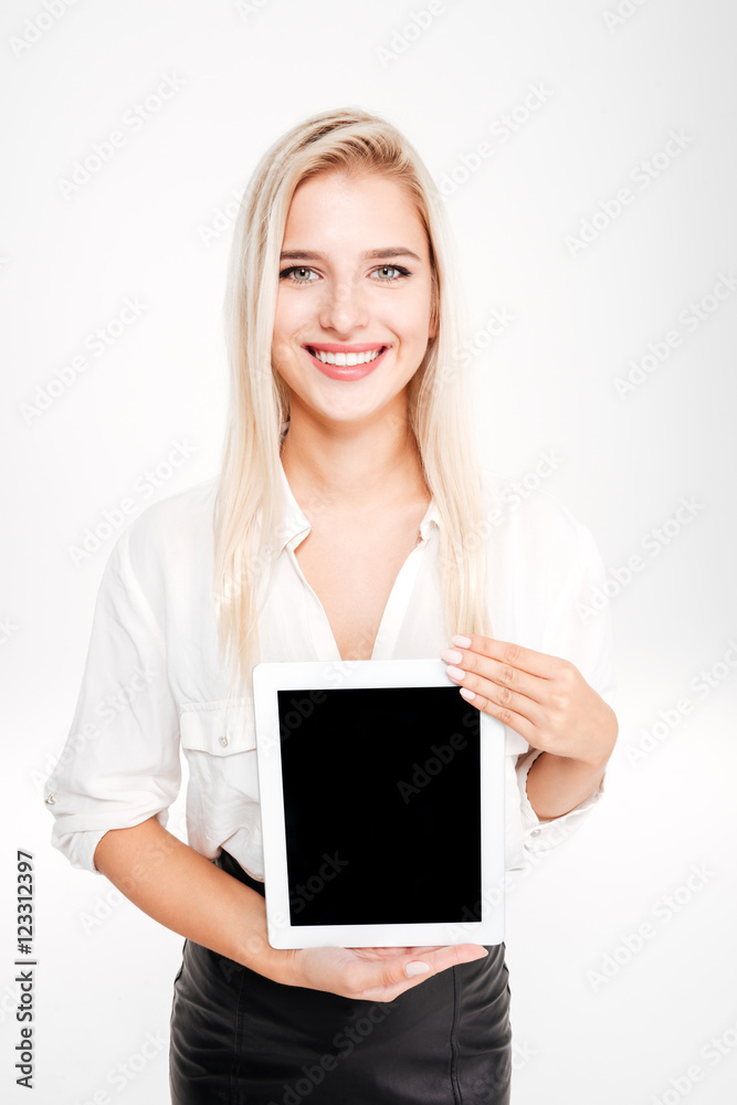Smiling businesswoman showing tablet with blank screen Smiling businesswoman showing tablet with blank screen