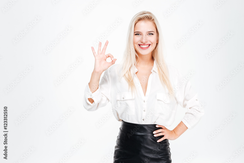 Happy young businesswoman showing ok sign Happy young businesswoman showing ok sign