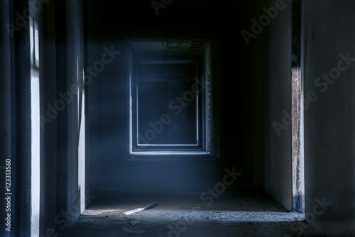 Creepy night walkway hallway in abandoned building