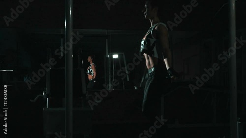 Slowmo ,skipping woman training at gym, lowlight