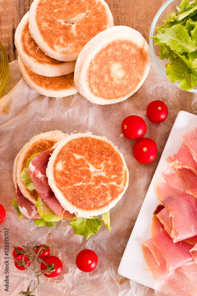Tigella bread stuffed with ham and lettuce. Tigella bread stuffed with ham and lettuce.