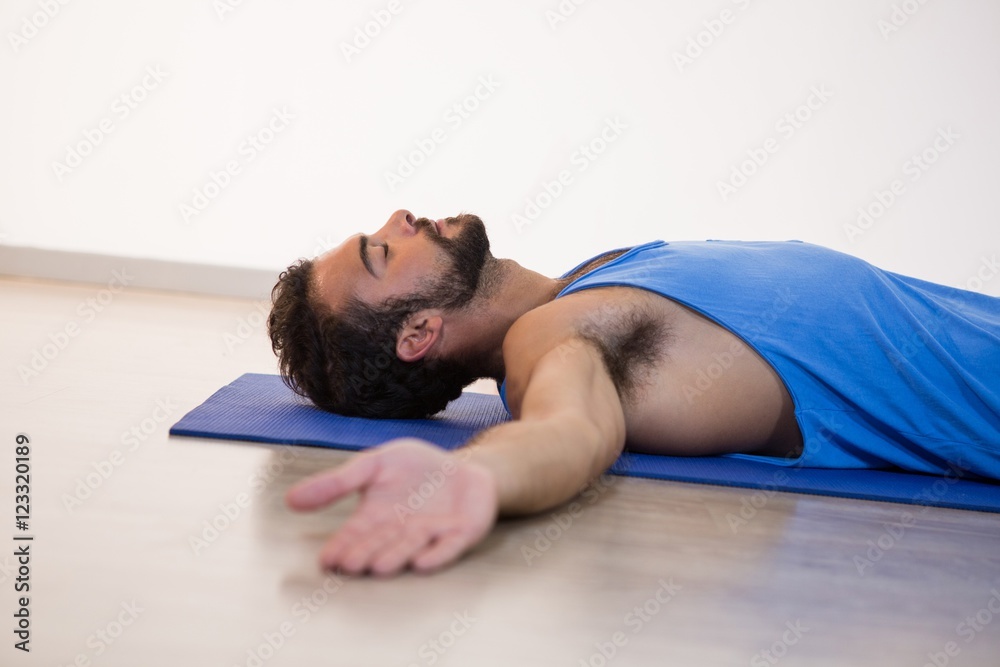 Man in yoga corpse pose Man in yoga corpse pose