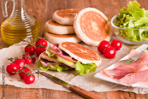 Tigella bread stuffed with ham and lettuce. photo