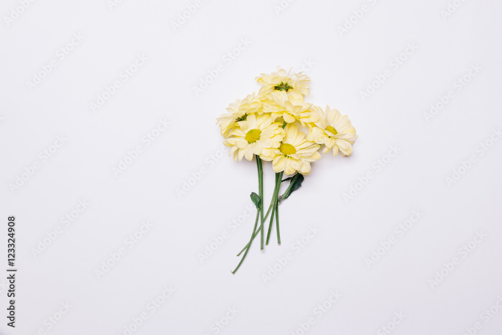 Fototapeta premium Bouquet of yellow flowers on a white table