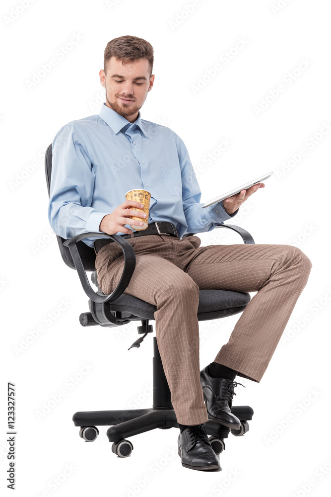 businessman sitting in a office chair and drinking coffee businessman sitting in a office chair and drinking coffee