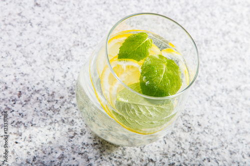 Glass with water with lemon slices