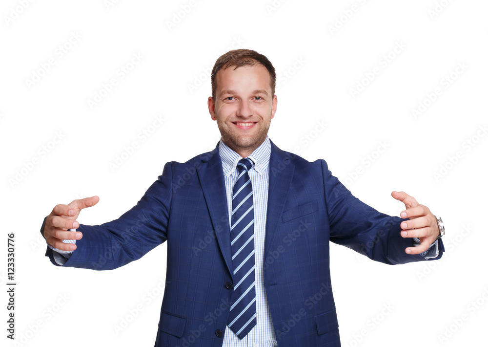 Young happy businessman holds something isolated on white Young happy businessman holds something isolated on white