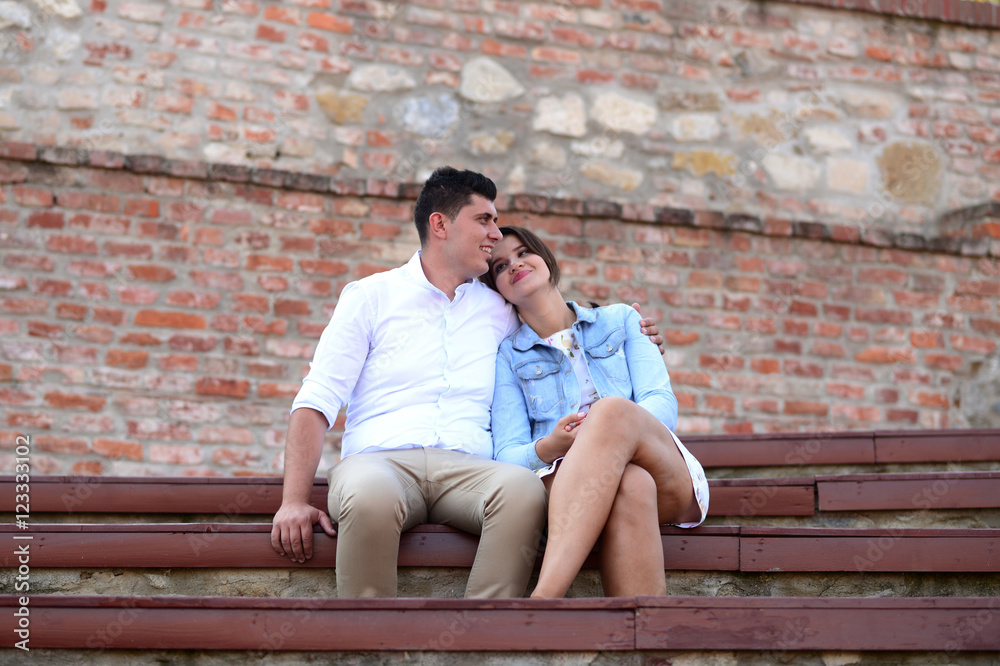 Attractive romantic couple in Oradea citadel