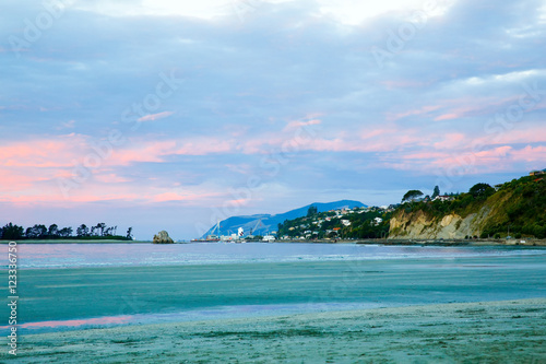Colorful sunset sky with overcast clouds at Wharariki Beach, Nelson