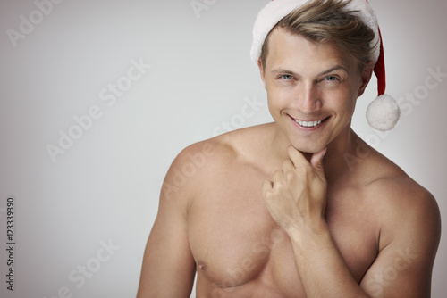 Close up of handsome man with Santa hat.