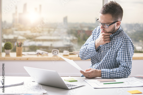 Young man doing paperwork