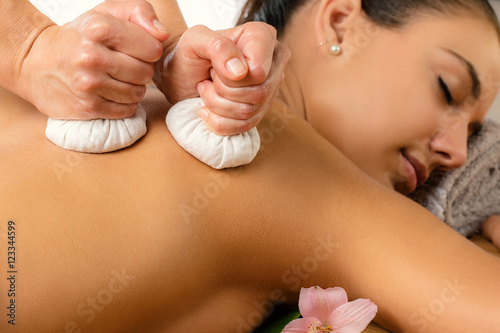 Detail of herbal pinda massage. photo