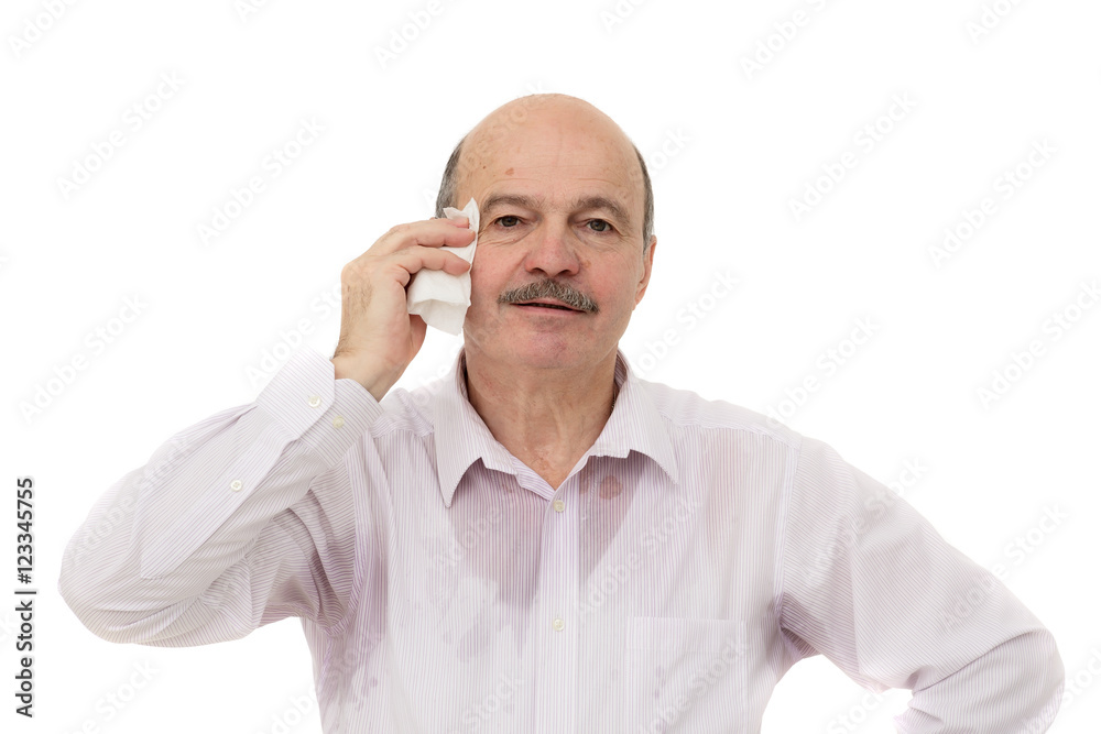 Sweaty spot on the shirt because of the heat, worries and diffidence. Elderly people suffering from the heat and stuffiness Sweaty spot on the shirt because of the heat, worries and diffidence. Elderly people suffering from the heat and stuffiness