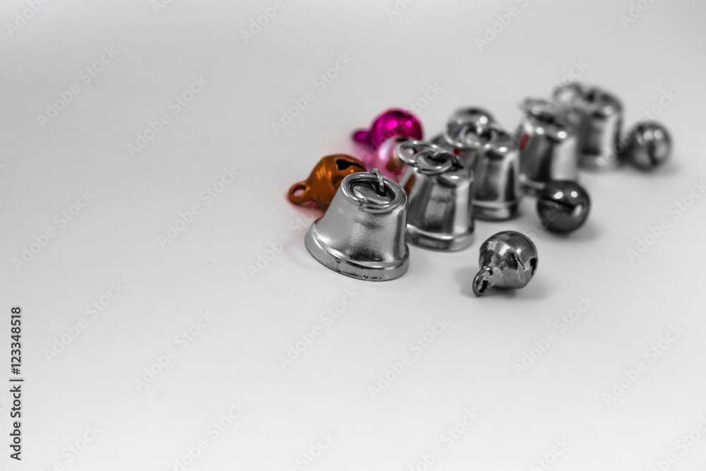 Small silver bells on white background. Silver bells on white background Small silver bells on white background. Silver bells on white background