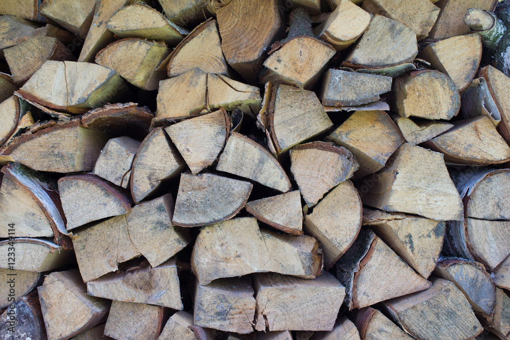 Background of dry chopped firewood logs Background of dry chopped firewood logs