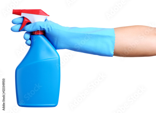 Spring cleaning woman's hand in rubber glove aiming blue spray bottle isolated on white photo