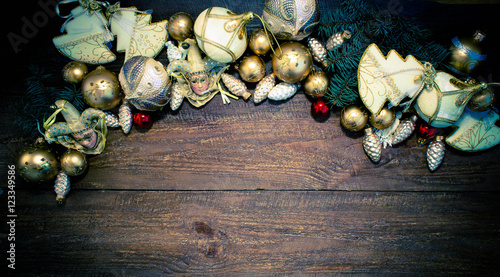 Obraz na plátně Christmas or New Year background: fur-tree branches, colorful glass balls, decor