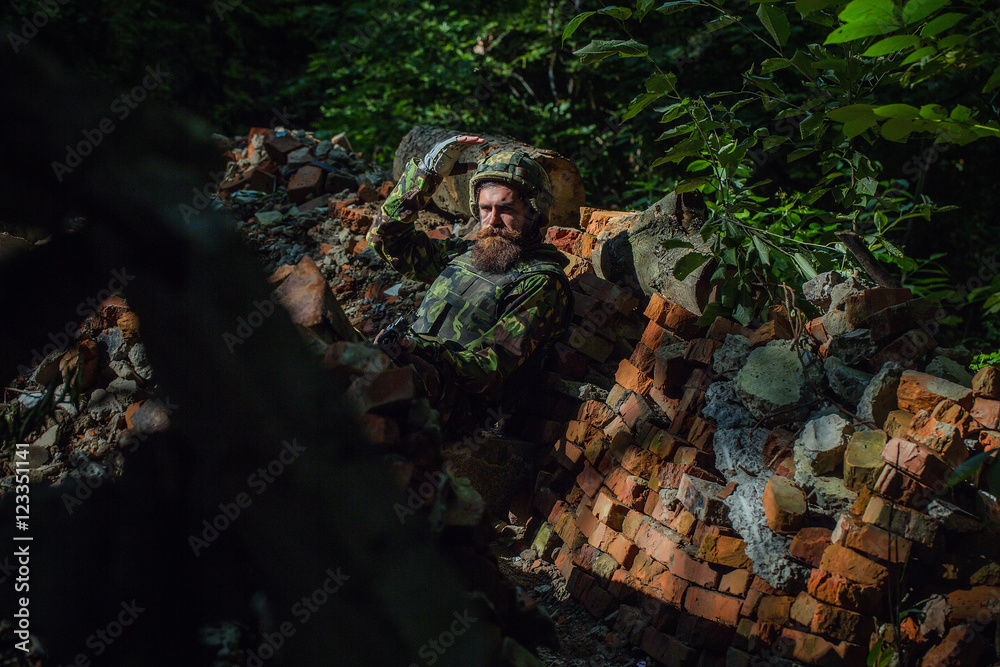 Young soldier with gun