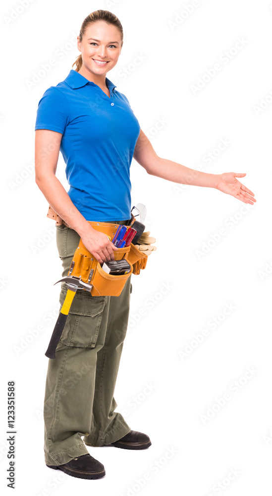Attractive woman contractor construction worker do-it-yourself showing explaining gesturing isolated on white background for use alone or as a design element Attractive woman contractor construction worker do-it-yourself showing explaining gesturing isolated on white background for use alone or as a design element