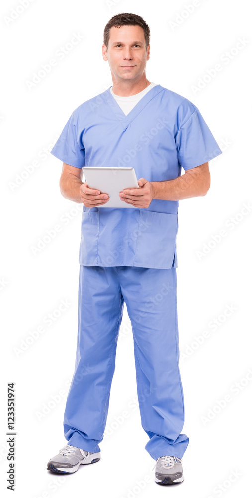 Full-length male man doctor nurse practitioner physical occupational therapist veterinarian dentist hospital clinic medical center worker with digital tablet isolated on white background