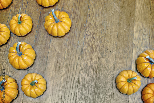 Orange pumpkins on the wood floor
